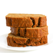 three slices of vegan pumpkin banana bread stacked.