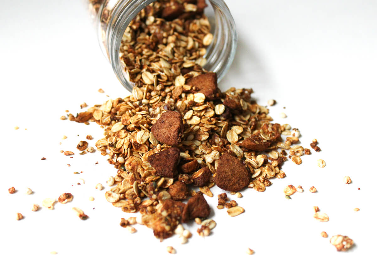 healthy gluten-free apple cinnamon granola made at home in glass jar.