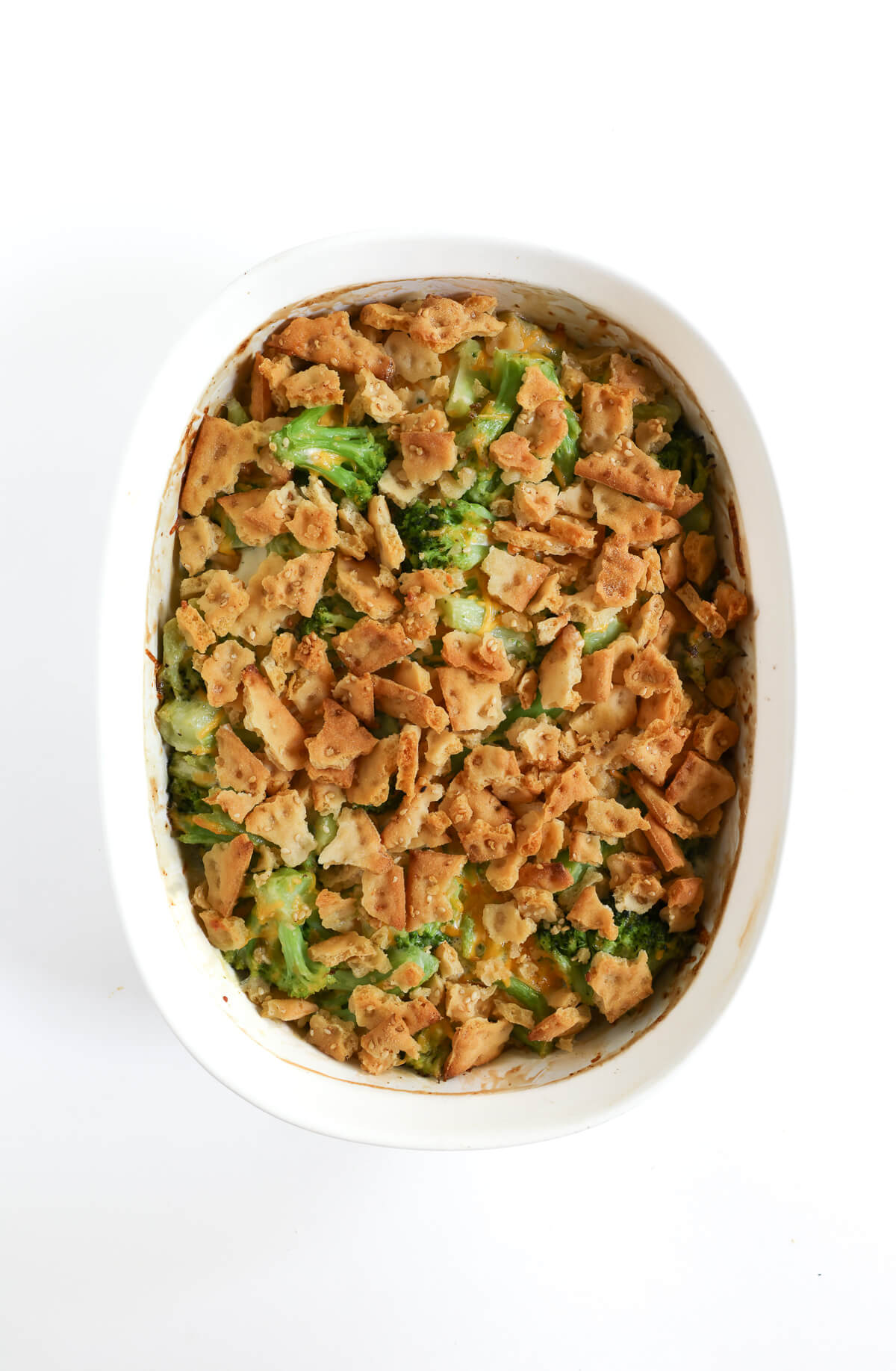 fully baked vegan broccoli casserole in white baking dish.