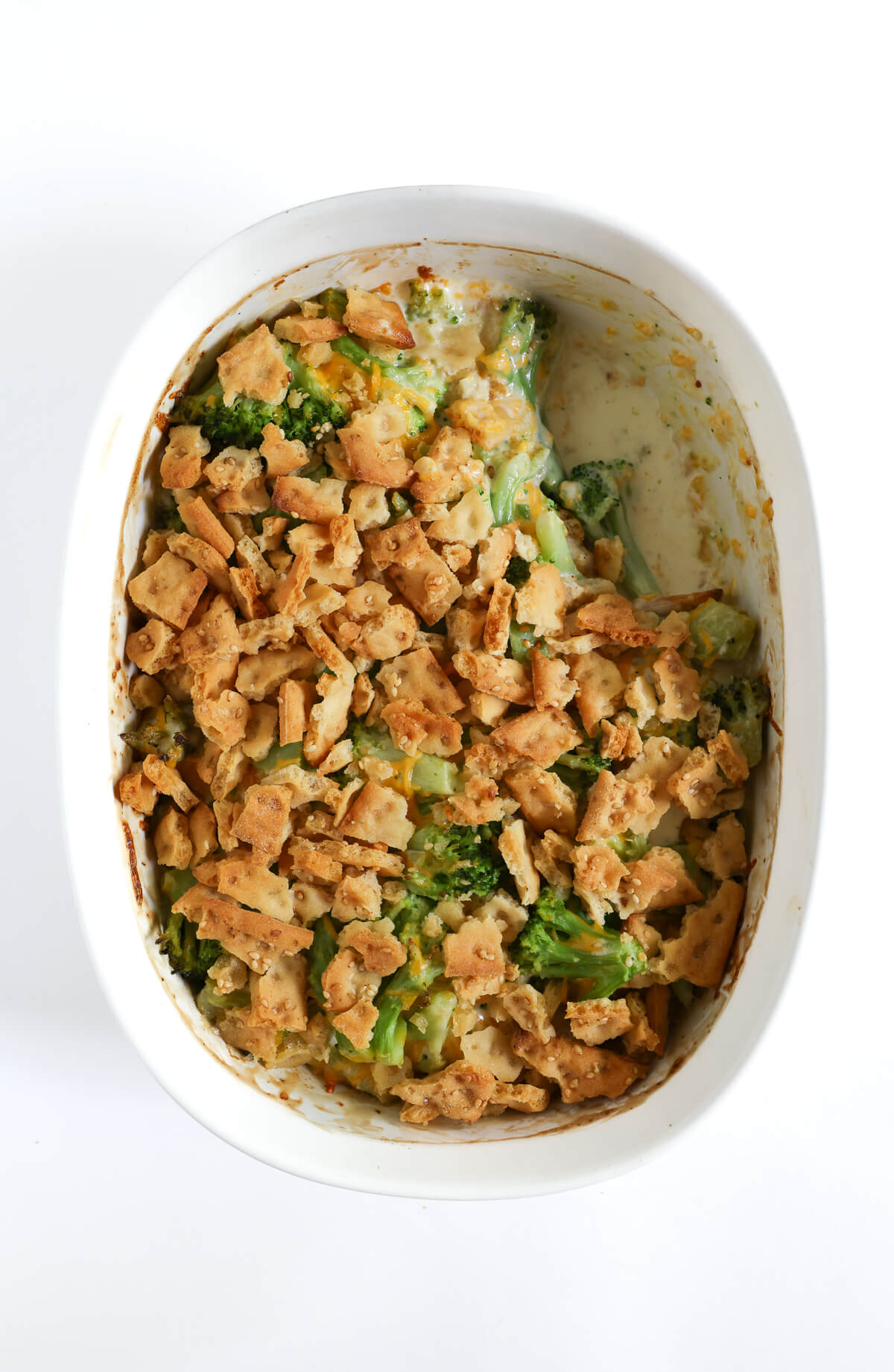 southern vegan broccoli casserole with a scoop taken out.