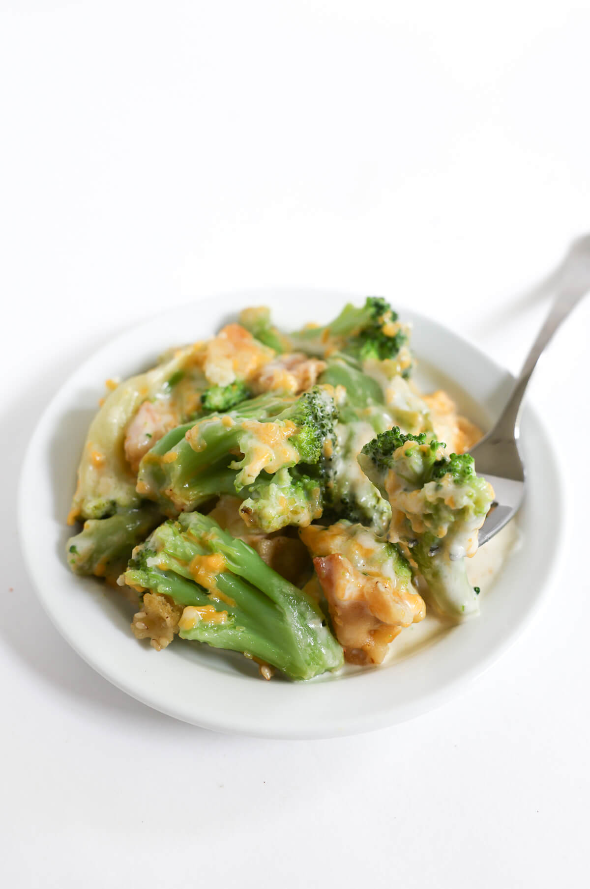 small plate with vegan broccoli casserole and fork.