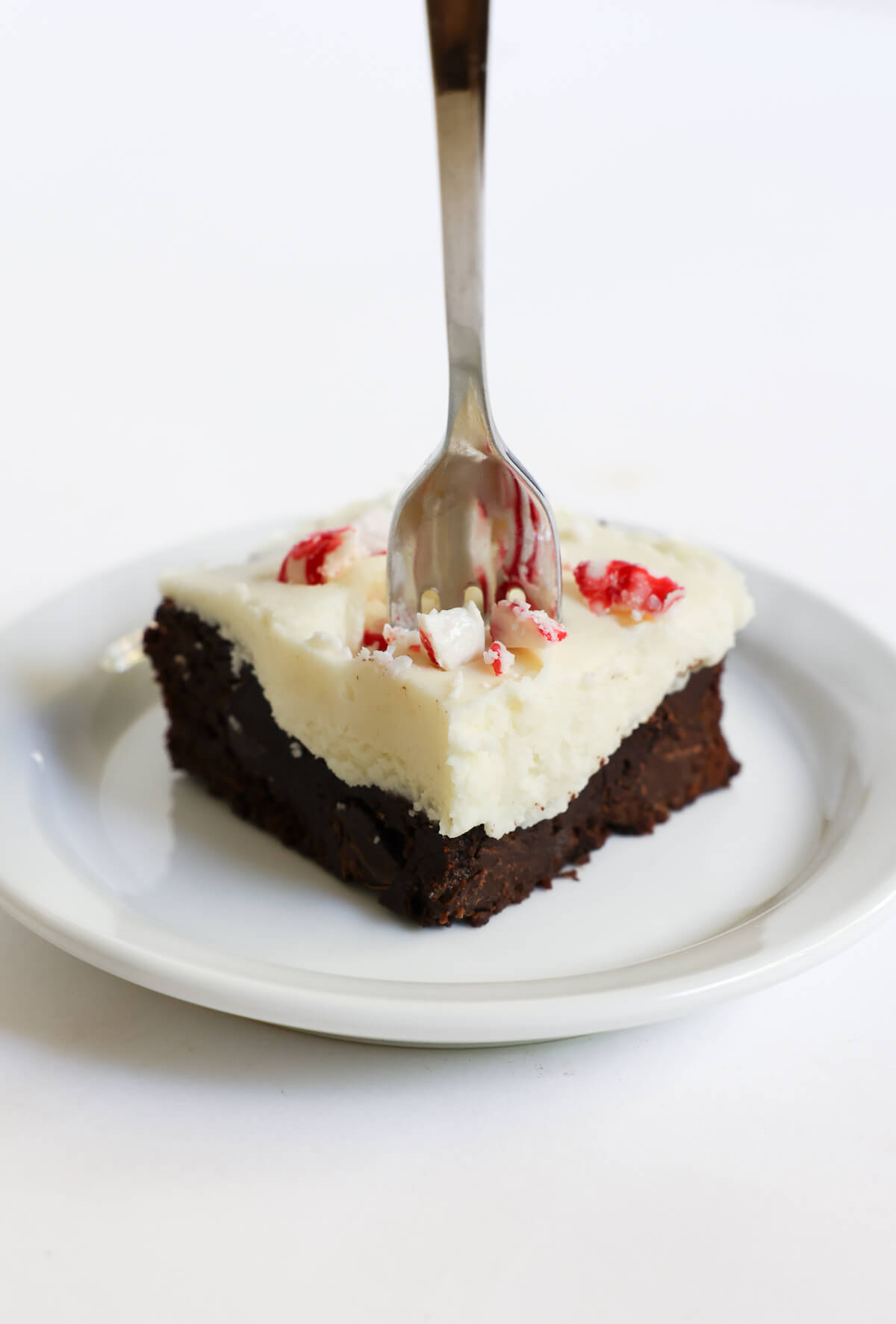 fork standing in peppermint bark brownie.