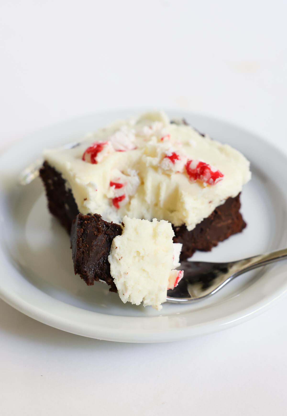 forkful of peppermint bark brownie serving.