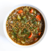 traditional lentil soup in white bowl.