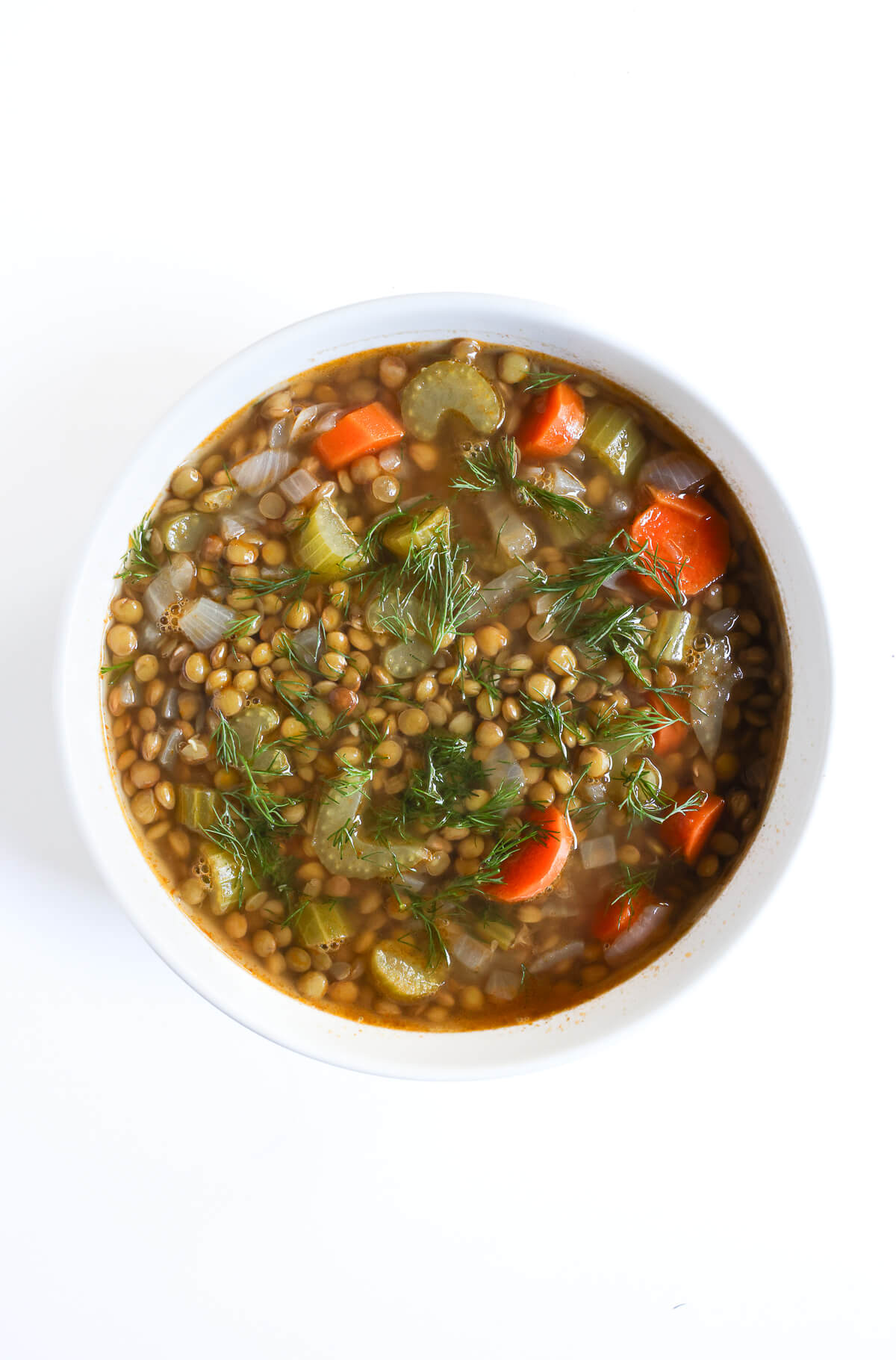 traditional lentil soup in white bowl.