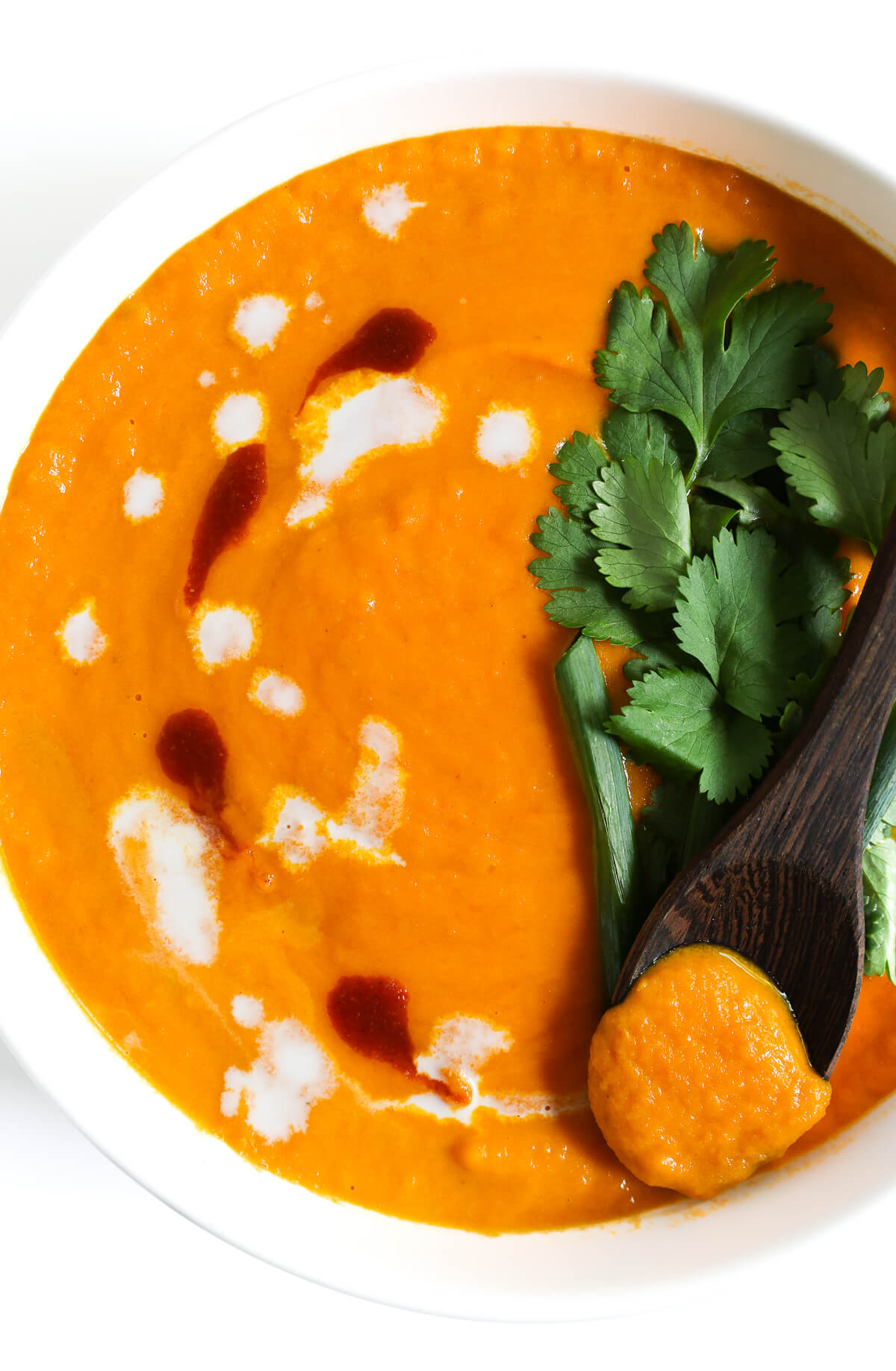 thai carrot soup with toppings to serve.