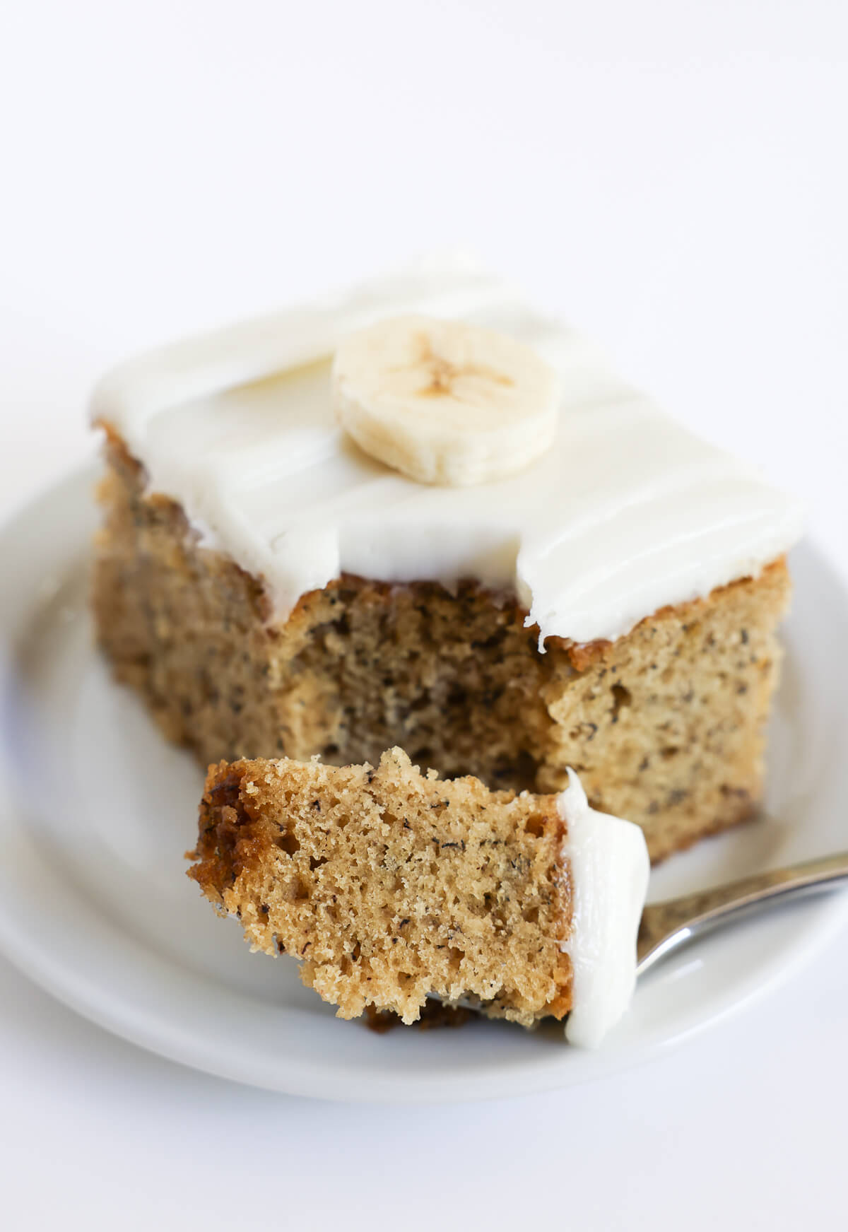 forkful of gluten-free banana cake slice.