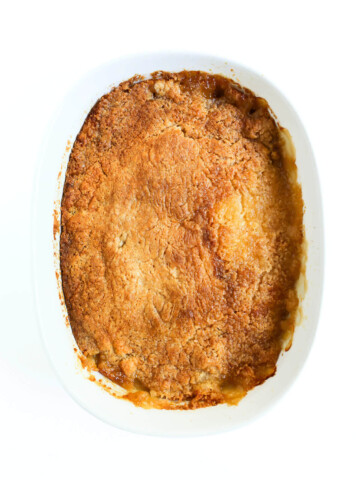 full casserole dish with peach dump cake.
